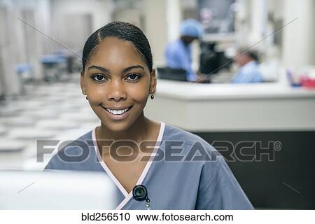 Stock Image - Portrait of smiling nurse. Fotosearch