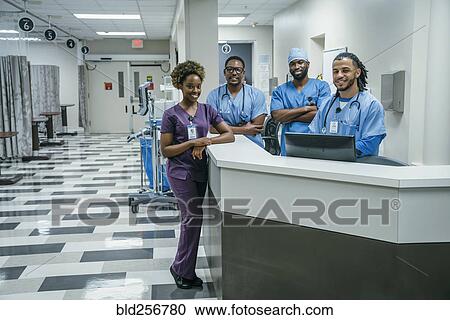 Stock Image - Portrait of smiling nurses in hospital. Fotosearch
