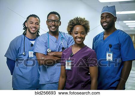 Stock Image - Portrait of smiling nurses. Fotosearch