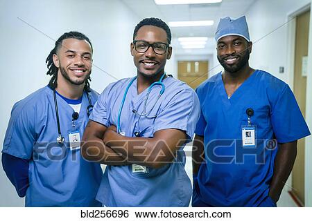Stock Photograph - Portrait of smiling nurses. Fotosearch