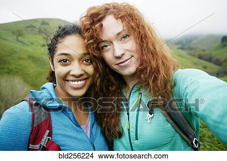Picture - Portrait of smiling women hiking. Fotosearch