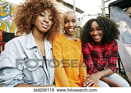 Stock Photo - Portrait of smiling women. Fotosearch