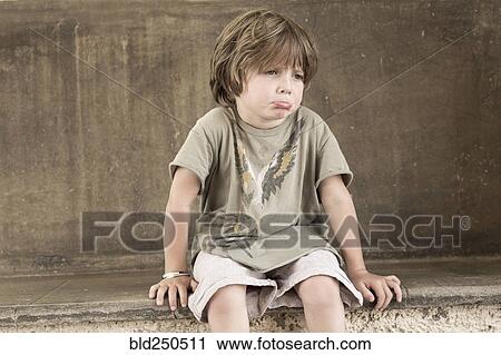 Stock Image - Pouting Caucasian boy. Fotosearch