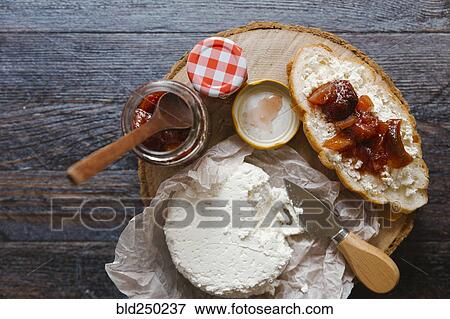 Stock Photo - Preserves and cheese on bread. Fotosearch