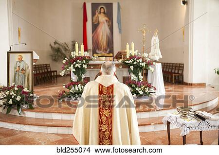 Priest in church View Large Photo Image Picture - Priest in church. Fotosearch