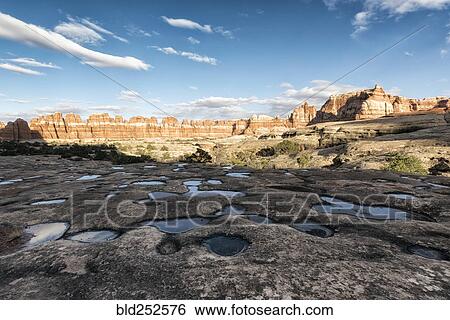 Stock Photograph - "Puddles in desert, Moab, Utah, United States". Fotosearch