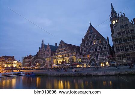 Stock Photograph - Quaint buildings in town at night. Fotosearch
