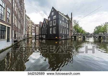 Reflection of buildings in urban canal View Large Photo Image Stock Photo - Reflection of buildings in urban canal. Fotosearch