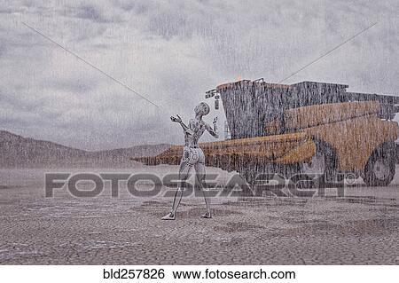 Stock Photograph - Robot looking up at rain in desert. Fotosearch