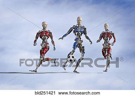 Stock Image - Robots playing soccer. Fotosearch