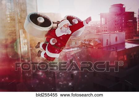Stock Photography - Santa flying jet pack in futuristic city. Fotosearch
