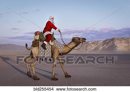 Santa riding camel in desert View Large Photo Image Picture - Santa riding camel in desert. Fotosearch