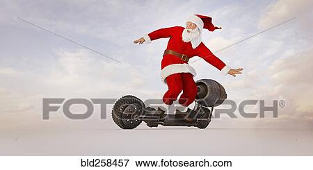 Stock Photo - Santa riding futuristic skateboard. Fotosearch