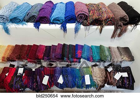 Scarves on shelf in store View Large Photo Image Picture - Scarves on shelf in store. Fotosearch