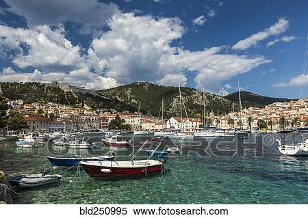 Stock Photography - Scenic view of boats in marina. Fotosearch