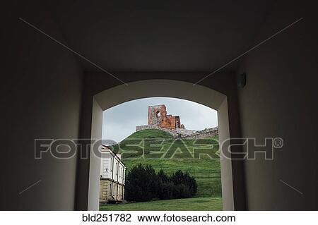 Stock Image - Scenic view of hill from arch. Fotosearch
