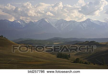 Scenic view of mountains and rolling landscape View Large Photo Image Stock Photograph - Scenic view of mountains and rolling landscape. Fotosearch