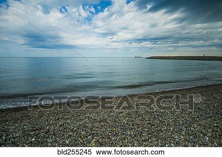 Stock Photography - Scenic view of ocean beach. Fotosearch