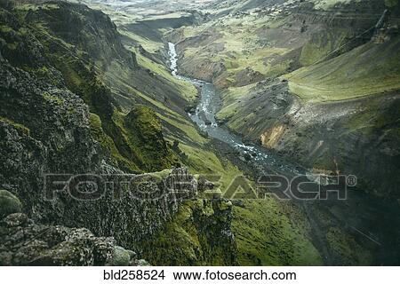 Picture - Scenic view of river in green valley. Fotosearch