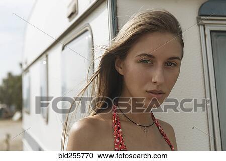 Serious Caucasian woman standing near trailer View Large Photo Image Stock Image - Serious Caucasian woman standing near trailer. Fotosearch