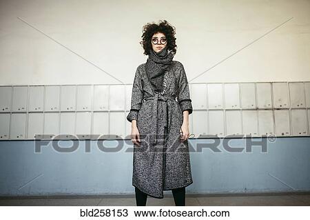 Serious Caucasian woman wearing scarf and coat View Large Photo Image Stock Image - Serious Caucasian woman wearing scarf and coat. Fotosearch