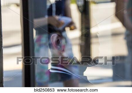 Serious Chinese man behind window View Large Photo Image Stock Image - Serious Chinese man behind window. Fotosearch