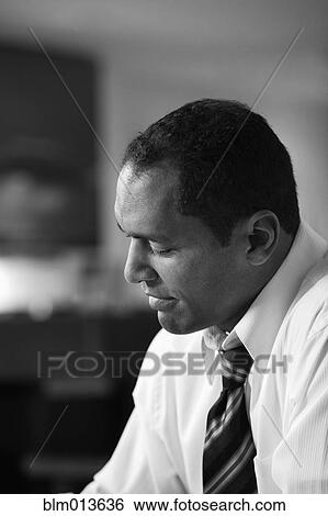 Stock Photograph - Serious mixed race businessman. Fotosearch