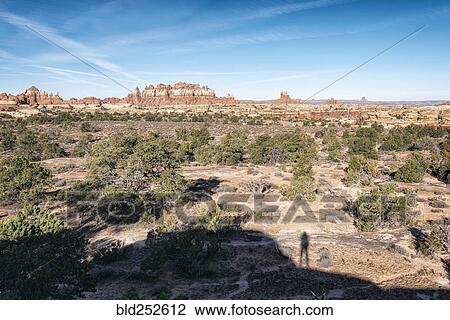 "Shadow of person admiring scenic view of desert, Moab, Utah, United States" View Large Photo Image Stock Image - "Shadow of person admiring scenic view of desert, Moab, Utah, United States". Fotosearch