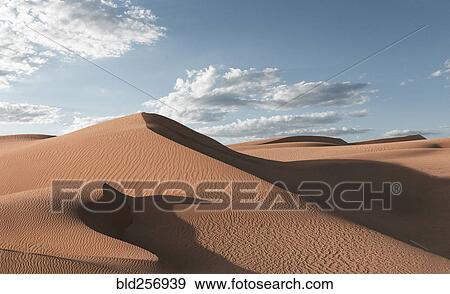 Stock Photo - Shadows on sand dunes in desert. Fotosearch