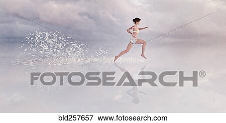 Shards breaking from floor behind running woman View Large Photo Image Stock Photo - Shards breaking from floor behind running woman. Fotosearch