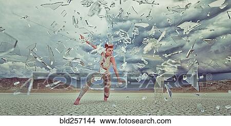 Picture - Shards of glass surrounding futuristic woman in desert. Fotosearch