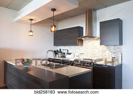 Stock Image - Sink and oven in modern kitchen. Fotosearch