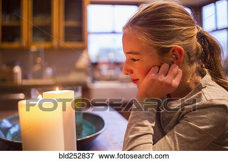 Smiling and Caucasian girl watching candles View Large Photo Image Stock Photo - Smiling and Caucasian girl watching candles. Fotosearch