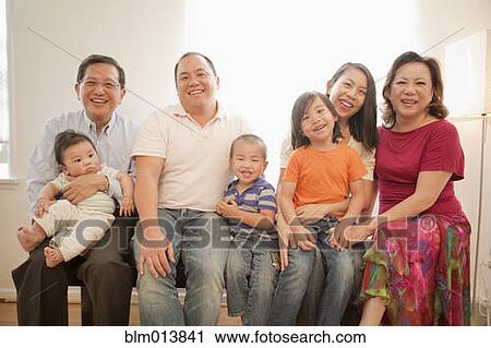 Stock Image - Smiling Asian family. Fotosearch