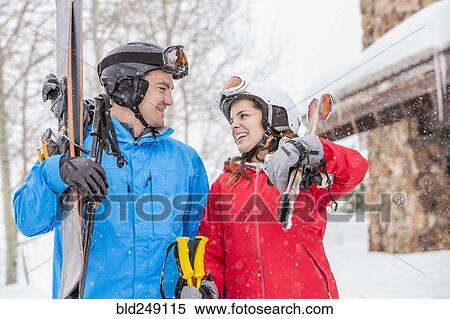 Smiling Caucasian couple carrying skis View Large Photo Image Stock Photography - Smiling Caucasian couple carrying skis. Fotosearch