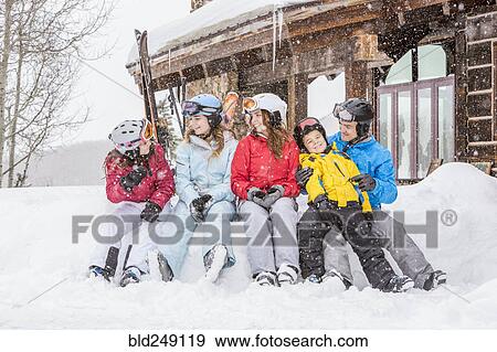 Stock Photo - Smiling Caucasian family on winter vacation. Fotosearch