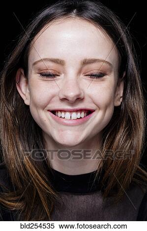 Smiling Caucasian woman with eyes closed View Large Photo Image Stock Photography - Smiling Caucasian woman with eyes closed. Fotosearch