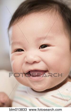 Stock Image - Smiling Chinese baby boy. Fotosearch