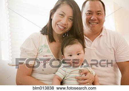 Smiling Chinese family View Large Photo Image Stock Photo - Smiling Chinese family. Fotosearch