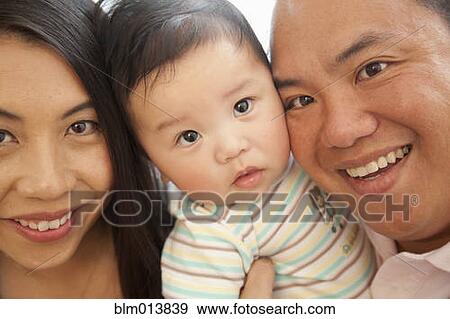 Stock Photo - Smiling Chinese family. Fotosearch