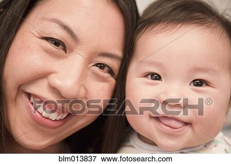 Stock Photo - Smiling Chinese mother and son. Fotosearch