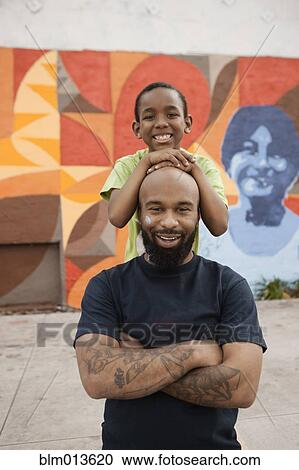 Stock Image - Smiling father and son. Fotosearch