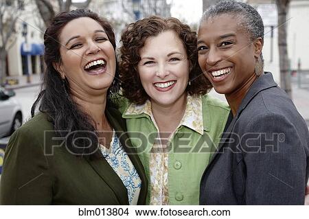 Picture - Smiling friends standing together. Fotosearch