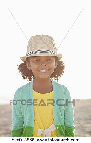Smiling mixed race girl on beach View Large Photo Image Stock Photo - Smiling mixed race girl on beach. Fotosearch