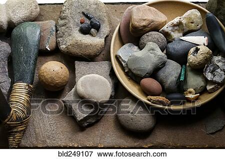 Stock Photo - Stones in bowl and traditional tools. Fotosearch