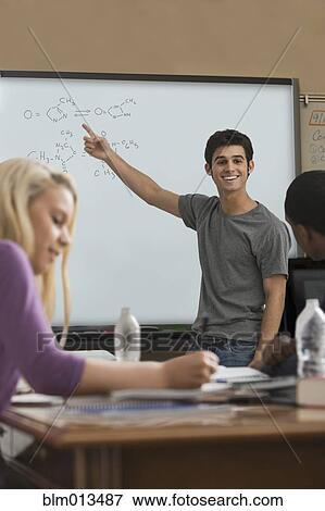 Student explaining formula in classroom View Large Photo Image Stock Photo - Student explaining formula in classroom. Fotosearch