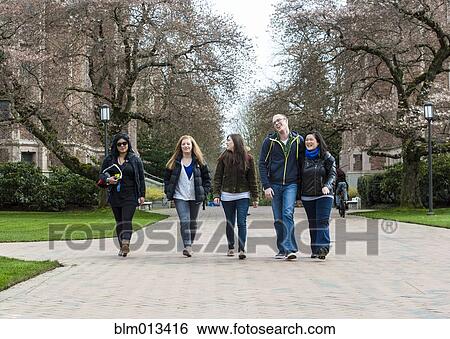 Stock Photograph - Students walking on campus together. Fotosearch