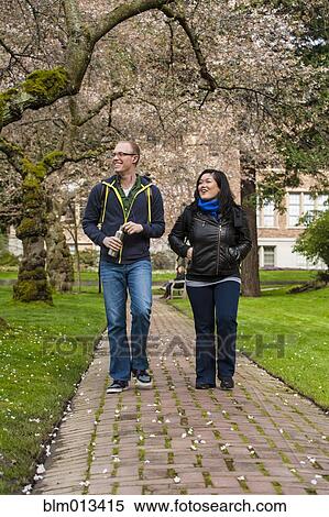 Stock Photography - Students walking on campus together. Fotosearch