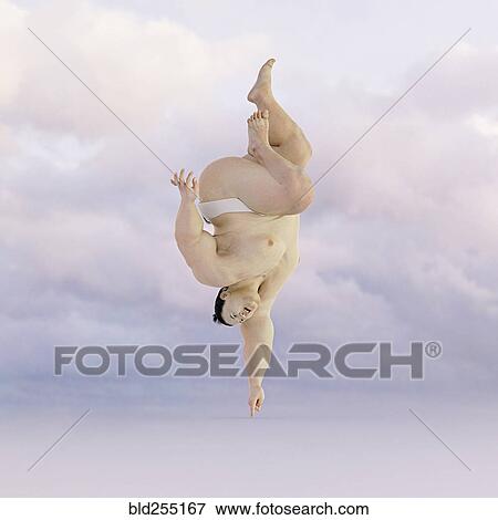 Sumo wrestler balancing upside-down on finger View Large Photo Image Stock Photo - Sumo wrestler balancing upside-down on finger. Fotosearch