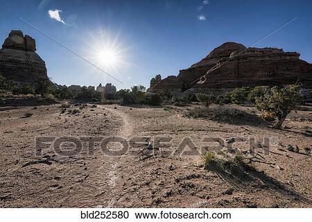"Sun in blue sky over desert, Moab, Utah, United States" View Large Photo Image Stock Image - "Sun in blue sky over desert, Moab, Utah, United States". Fotosearch